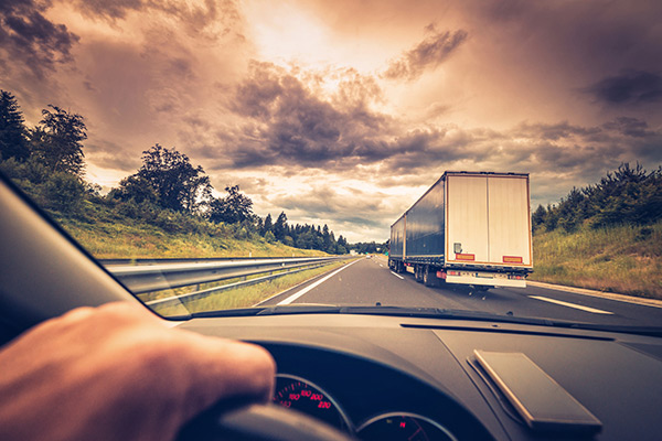 driver passing big rig