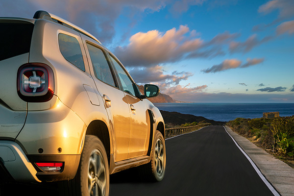 SUV driving toward beach